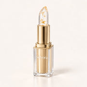 Belvora Signature Lipstick in its clear case with gold cartridge and gold-flecked balm